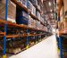 interior-gran-almacen-distribucion-estantes-apilados-paletas-productos-listos-mercado